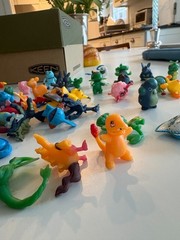 About 100 tiny pokemon figurines