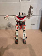 Vintage 1985 Transformers G1 Jetfire figure with accessory pieces.