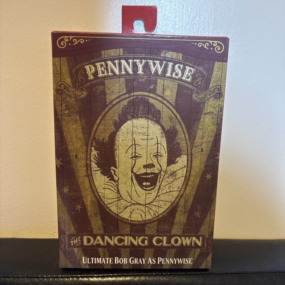 NECA Ultimate Bob Gray as Pennywise The Dancing Clown Welcome To Derry In Hand