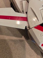 Vintage 1985 Transformers G1 Jetfire figure with accessory pieces.