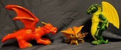3 Cartoonish looking Dragons, large eyes, different brands