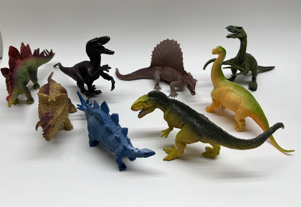 Lot of 8 Mixed Toy Plastic Rubber Dinosaurs. Tallest Around 4”.