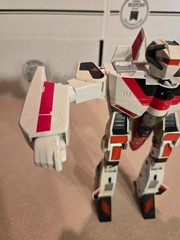 Vintage 1985 Transformers G1 Jetfire figure with accessory pieces.