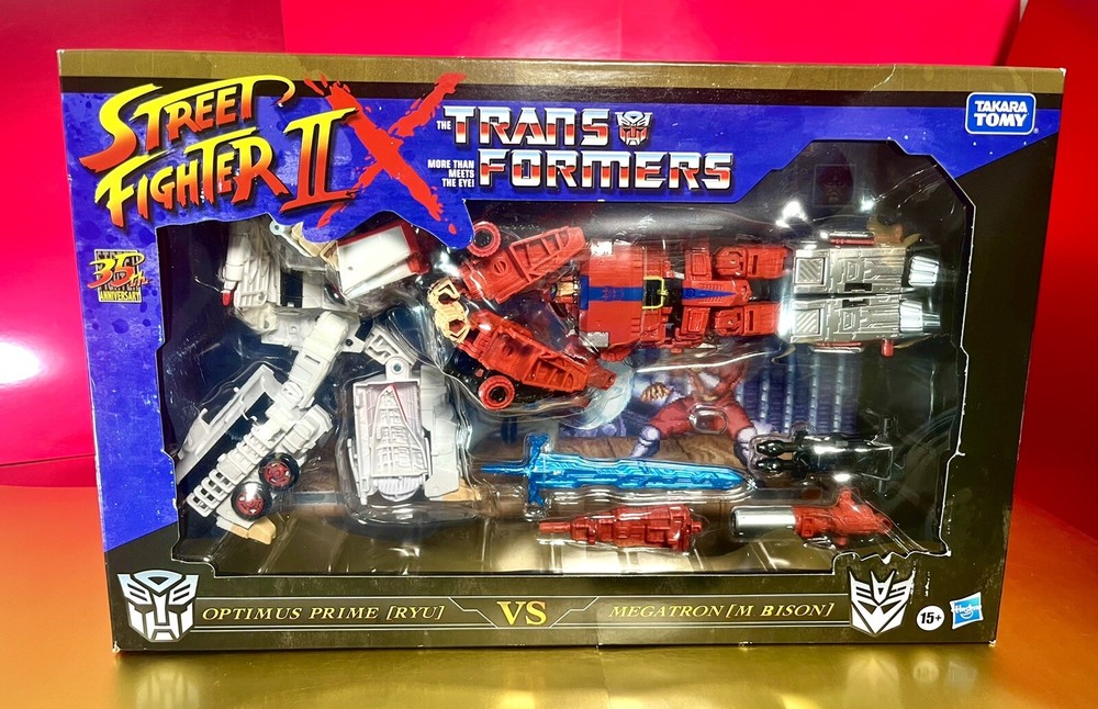 2022 Street Fighter II x Transformers – Optimus Prime (RYU) vs Megatron (BISON)