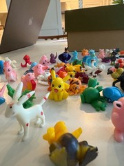 About 100 tiny pokemon figurines