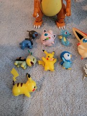 Pokémon Mixed Lot Of Figures, Coins, Pins, Tops Trading Cards