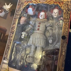 NECA Ultimate Bob Gray as Pennywise The Dancing Clown Welcome To Derry In Hand