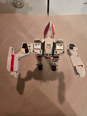 Vintage 1985 Transformers G1 Jetfire figure with accessory pieces.