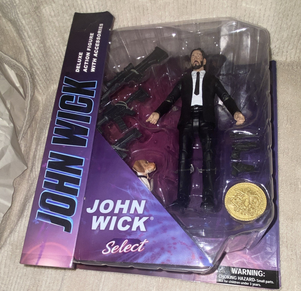 DIAMOND SELECT JOHN WICK DELUXE ACTION FIGURE WITH DOG, COIN & GUNS