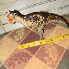 Carnotaurus action figure – orange & black plastic toy (7 inch)