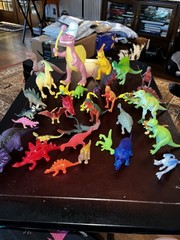 Large Lot of 34 Plastic Resin, Acrylic.-Resin and Rubberl Dinosaur figures.