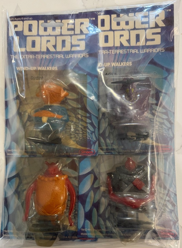 1982 POWER LORDS COMPLETE SET OF 4 WIND UP WALKERS MINT ON CARDS FROM STRACO.