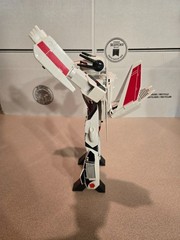 Vintage 1985 Transformers G1 Jetfire figure with accessory pieces.