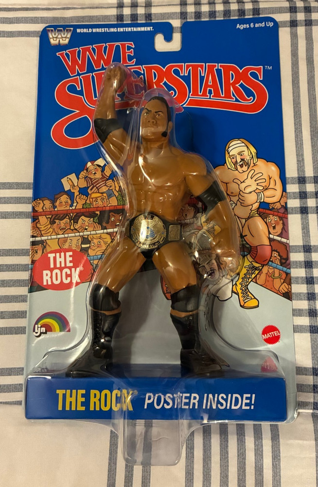 2026 WWE SUPERSTARS THE ROCK-BLUE BACKING-NEW IN ORIGINAL SEALED PACKAGE