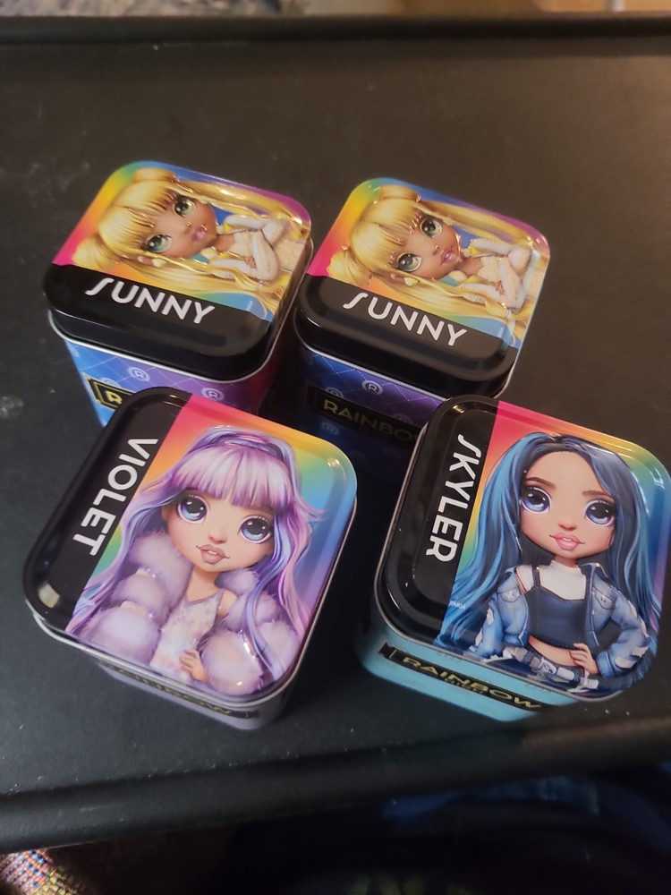 Rainbow High Surprise collectible Tins: VIOLET, SUNNY, SKYLER, SUNNY. USED. READ