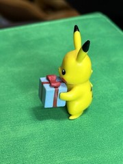 Pikachu Holding A Present Figure 2021 Jawares LLC