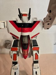 Vintage 1985 Transformers G1 Jetfire figure with accessory pieces.
