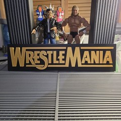 WWE Mattel Large 12 X 3 Gold WrestleMania Logo Accessory