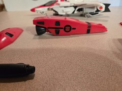 Vintage 1985 Transformers G1 Jetfire figure with accessory pieces.