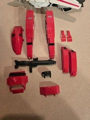Vintage 1985 Transformers G1 Jetfire figure with accessory pieces.