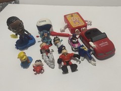 Collection of Various Small Toys and Action Figures Many of Which Seem Much More