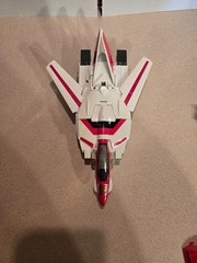 Vintage 1985 Transformers G1 Jetfire figure with accessory pieces.