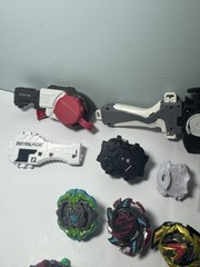 Beyblade Lot – Beyblades, Parts, and Launchers – See Photos & Read Desc