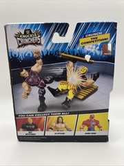 WWE KNUCKLE CRUNCHERS DOMINIK MYSTERIO 3.5″ FIGURE with BREAKABLE BOARD & 2×4
