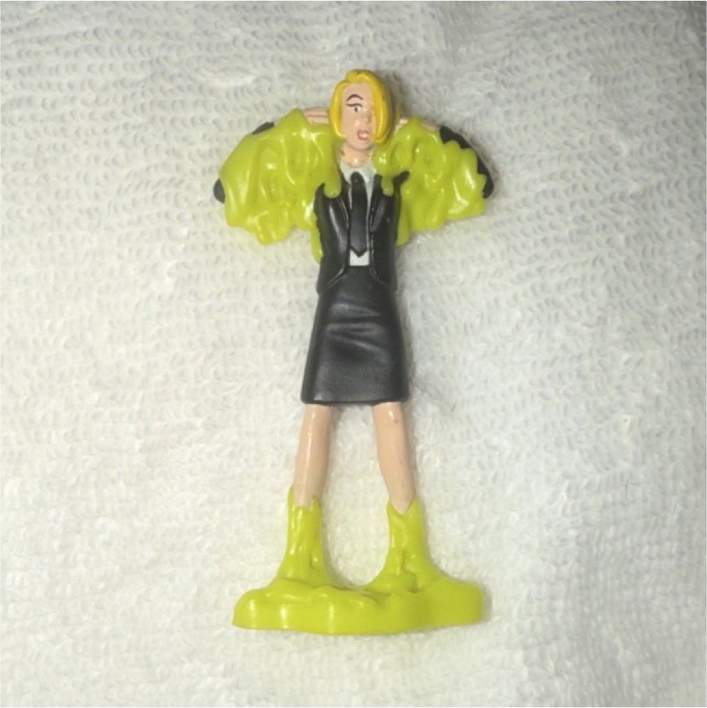 Plastic Figurine Toy Character in Black Dress with Green Base, Flesh Tone