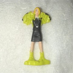 Plastic Figurine Toy Character in Black Dress with Green Base, Flesh Tone