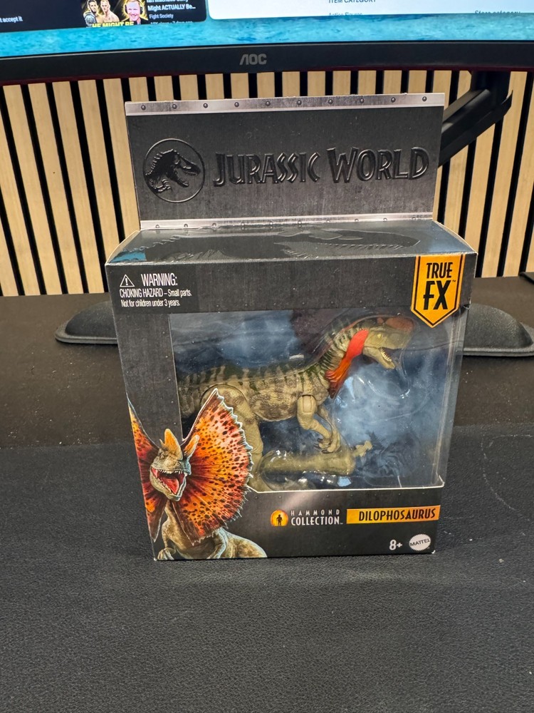 Mattel Jurassic World Hammond Collection Dilophosaurus Action Figure in Hand
