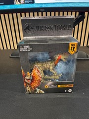 Mattel Jurassic World Hammond Collection Dilophosaurus Action Figure in Hand