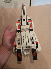 Vintage 1985 Transformers G1 Jetfire figure with accessory pieces.