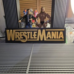 WWE Mattel Large 12 X 3 Gold WrestleMania Logo Accessory