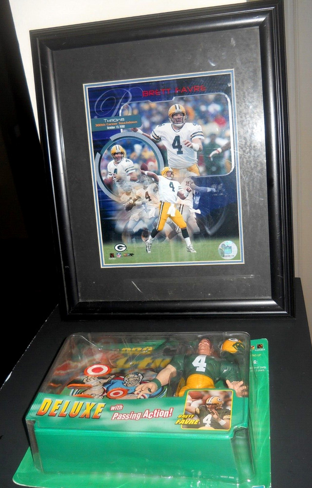 Bret Favre Mancave items 8″ x 10″ Photo in 13″ x 15″ Frame & Pro Action Football