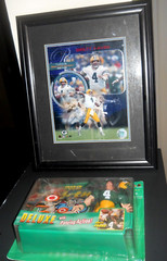 Bret Favre Mancave items 8″ x 10″ Photo in 13″ x 15″ Frame & Pro Action Football